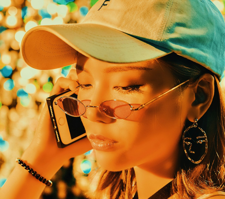 A woman taking a phone call with a skeptical expression.